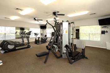 A well-equipped gym with a variety of exercise machines.